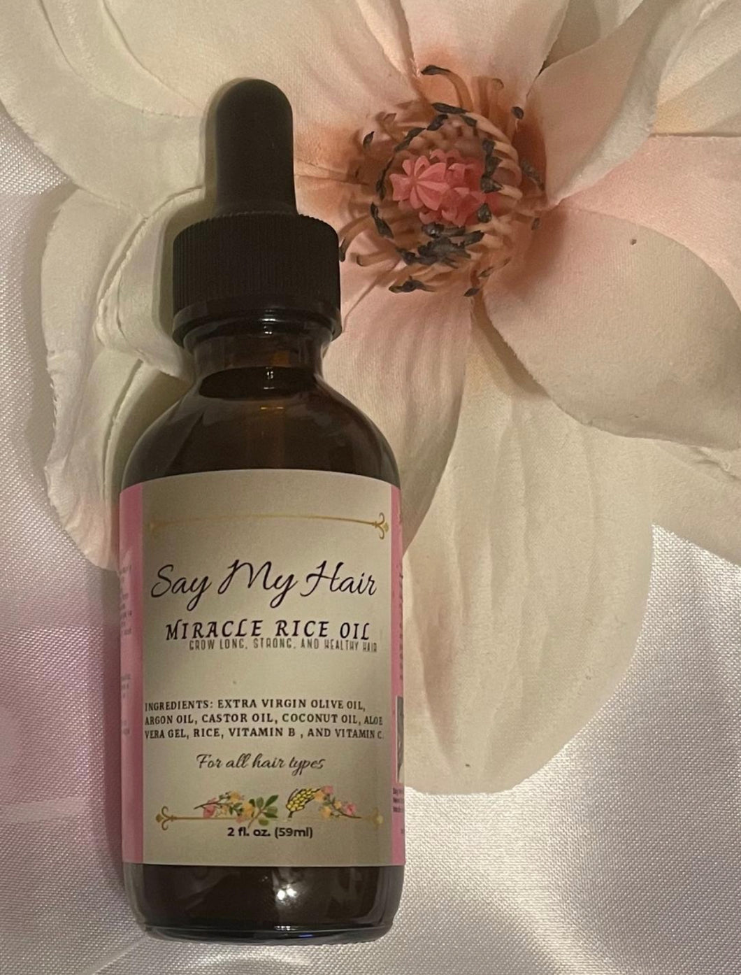 Front view of Miracle Rice Oil bottle for boosting hair health